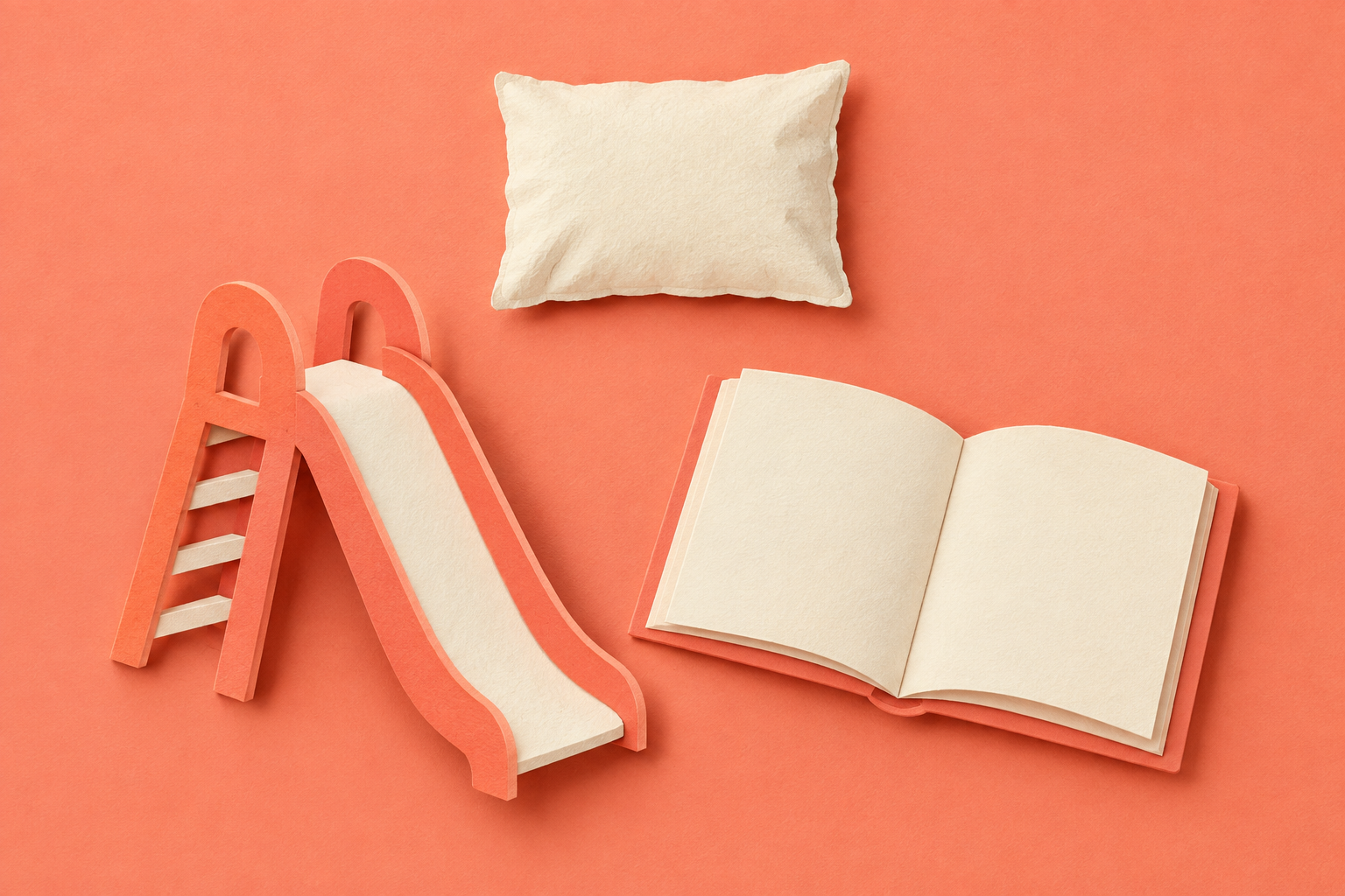 Cut-paper playground slide and open book beneath a small nap pillow.